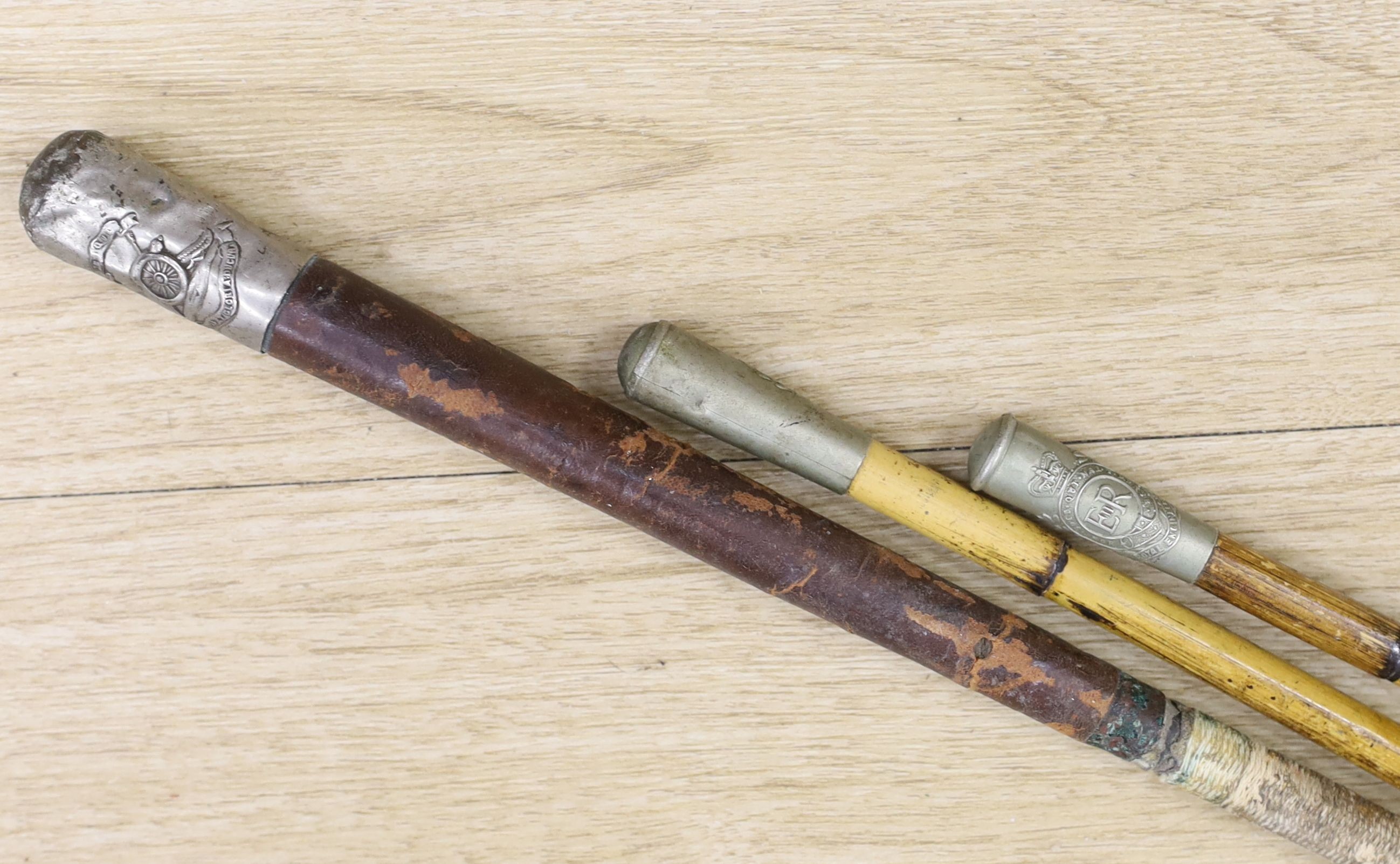 A Royal Engineers swagger stick, another swagger stick and one whip and a 1969 ammunition box